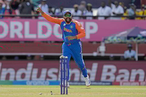Rohit Sharma celebrates the run-out of Adil Rashid